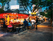 A lively food market with vibrant stalls serving delicious local cuisine