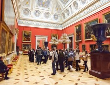 A grand museum hall filled with stunning paintings and sculptures
